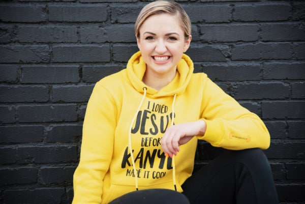 Anna Quinn wearing yellow Modest Muscle hoodie